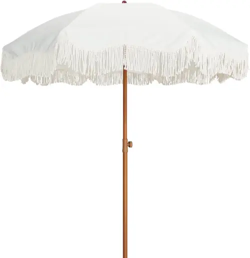 Ivory fringed umbrella with wood-look pole for outdoor flower bar rental in Ottawa